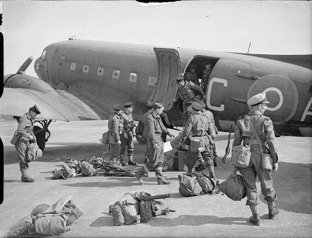 Royal Navy personnel unload RAF Dakota at Wilhelmshaven