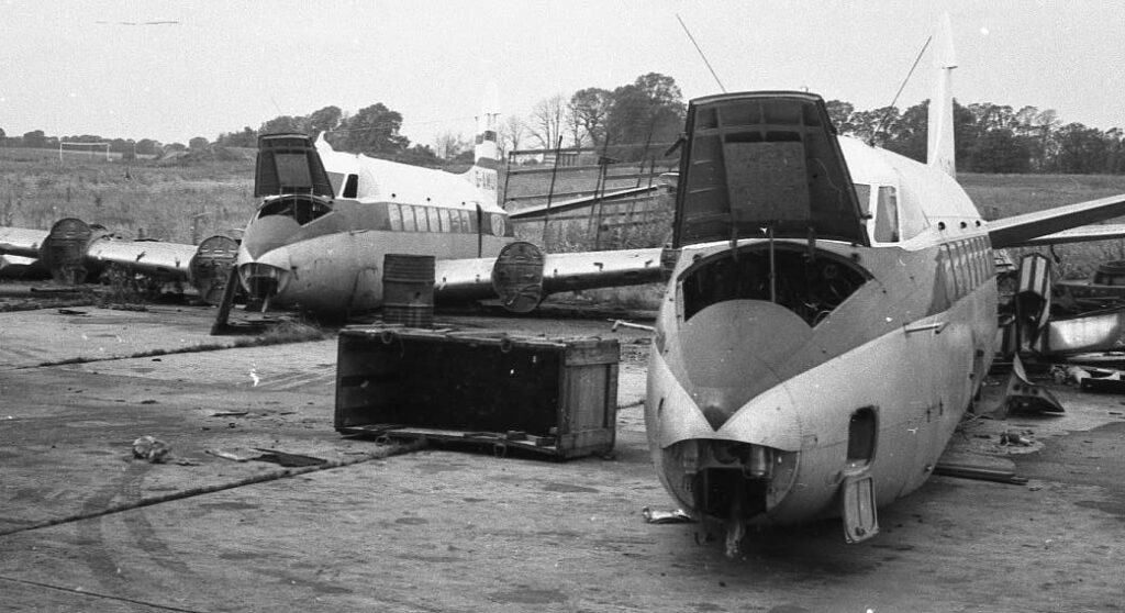 Two ex-Gulf Aviation Herons being broken up at Southend summer 1972